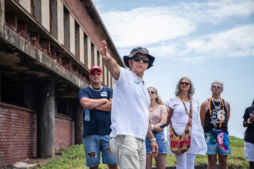 David giving tourists the background of the old factory site